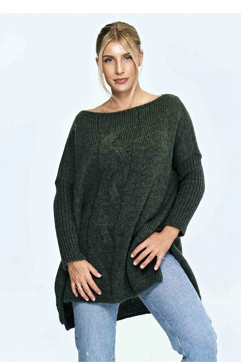 Loose-fit dark green cable knit sweater with boat neck, on model.