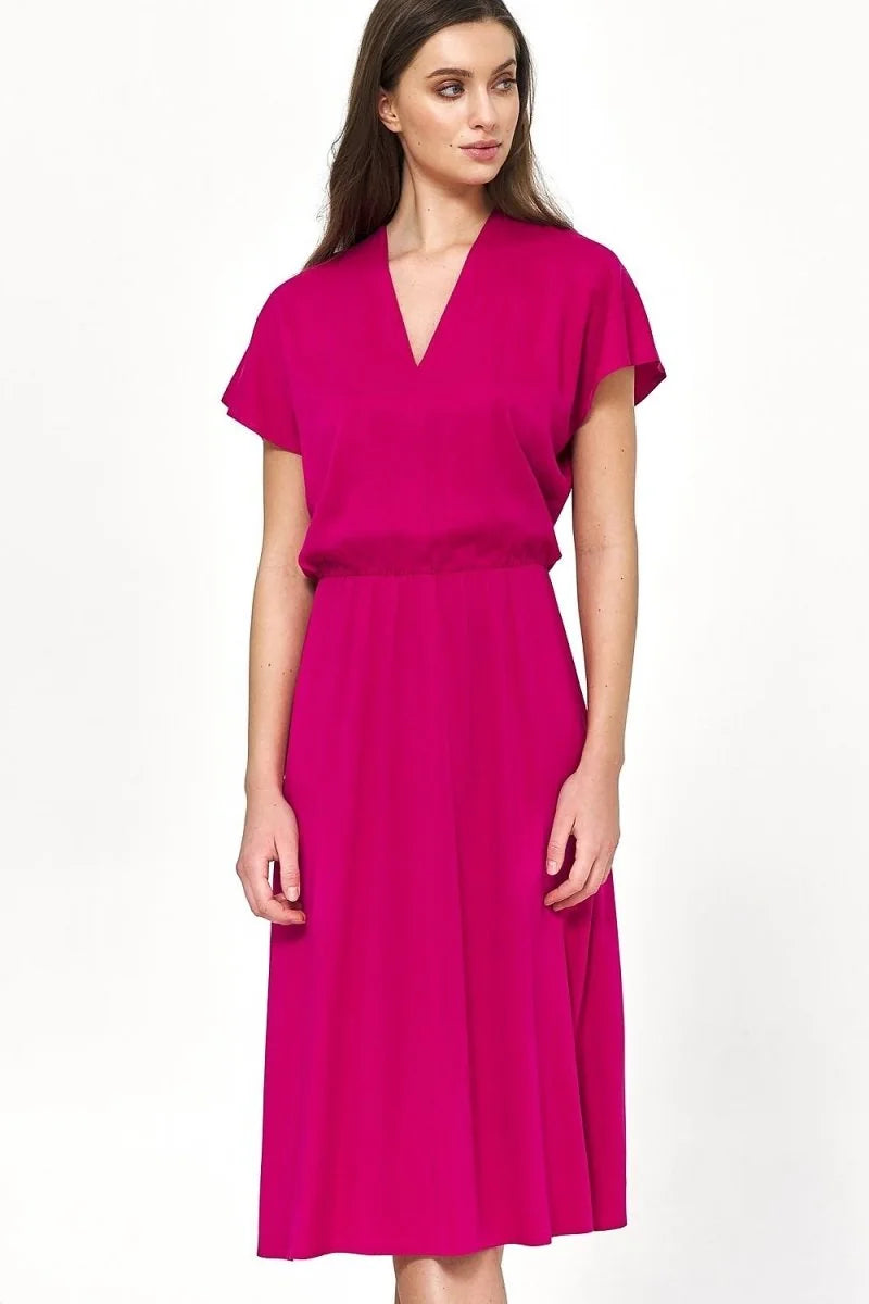 Vibrant fuchsia viscose midi dress with a V-neck and elasticized waist on a model.