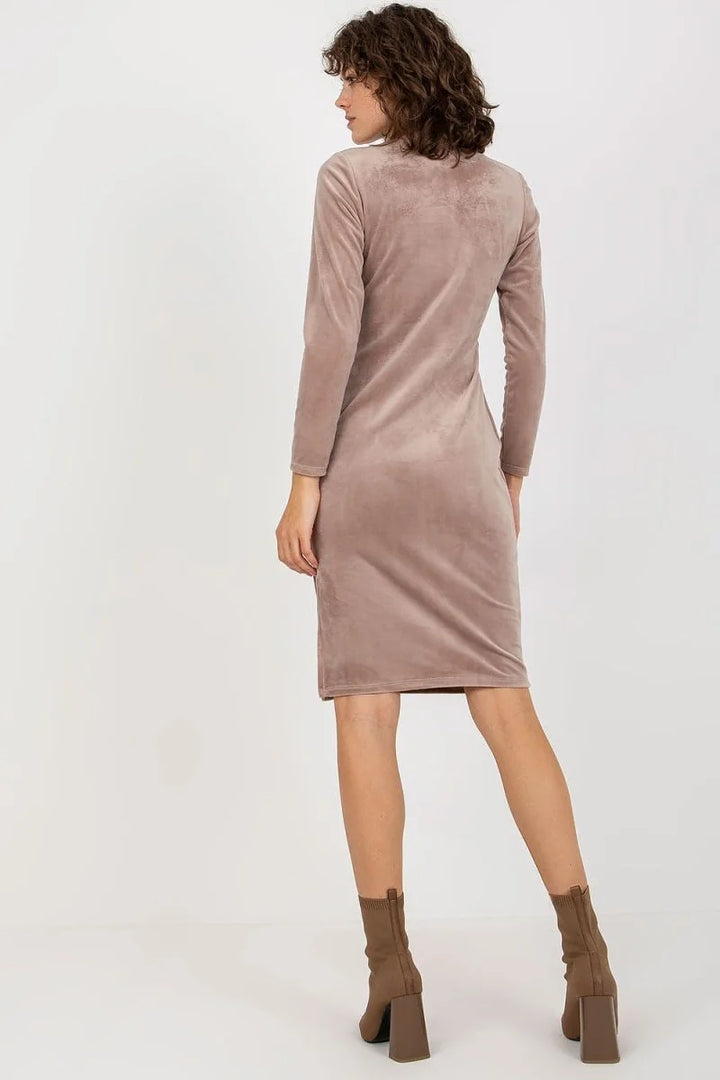 Taupe velvet midi dress with long sleeves and square-heeled boots.