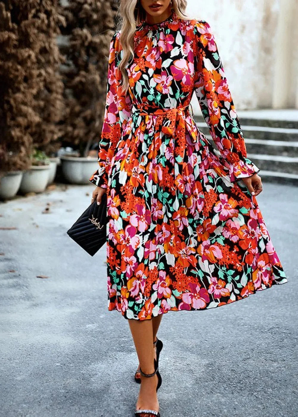 A vibrant floral print midi dress with a high neckline, long sleeves, and a belted waist.