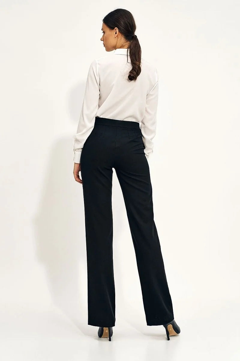 High-rise black pants with a wide leg fit, shown from the back on a model.