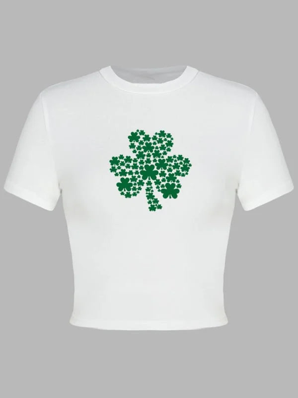 White cropped tee with a large green shamrock made of small shamrock prints.