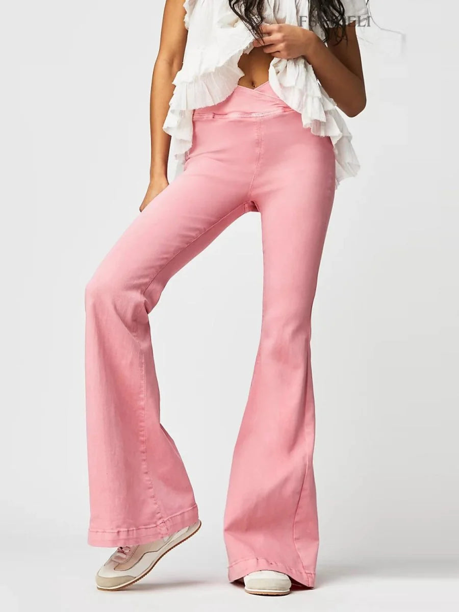 Watermelon pink flare jeans with a criss-cross waist detail and a textured, matte finish.