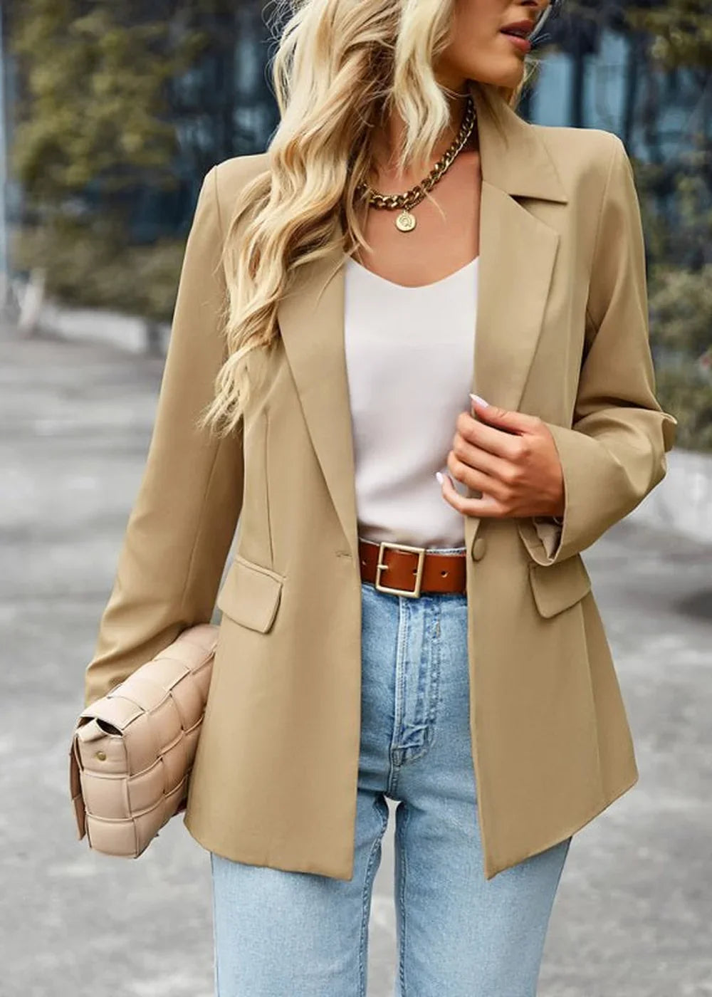 Tan blazer with gold chain necklace, white top, brown belt, and light wash jeans on model.