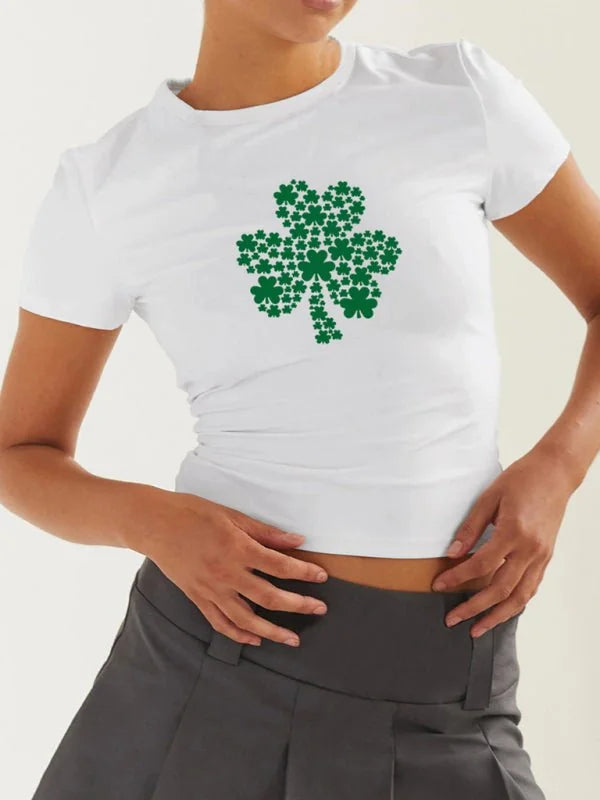 White cropped t-shirt with a large green shamrock print made of smaller shamrocks.