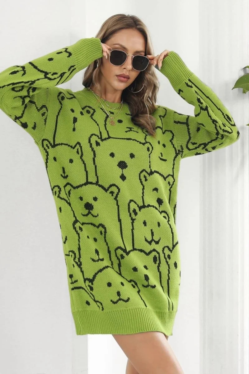Lime green sweater dress with a black teddy bear pattern, worn by a model with sunglasses.
