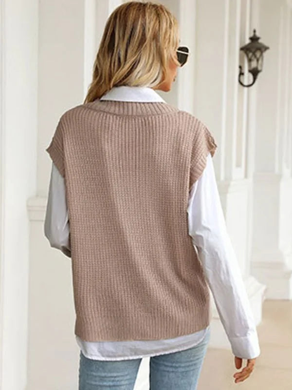 Back view of a tan ribbed knit sweater vest over a white collared shirt on a model.