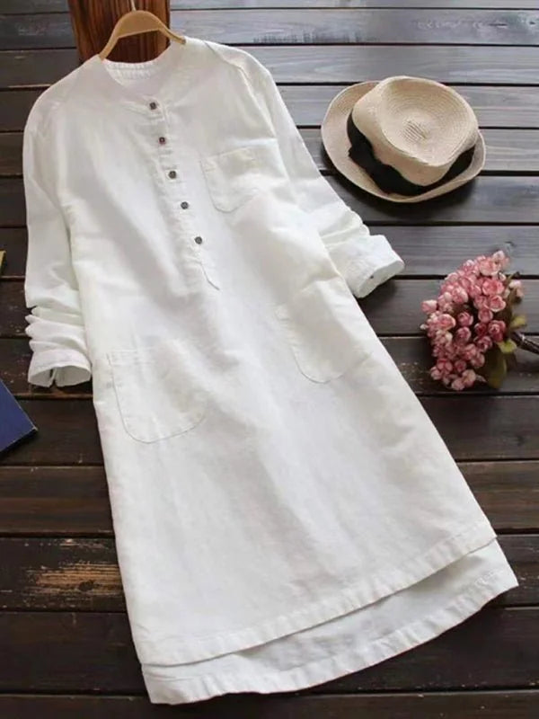 White linen blend long-sleeve dress with button front and two chest pockets.