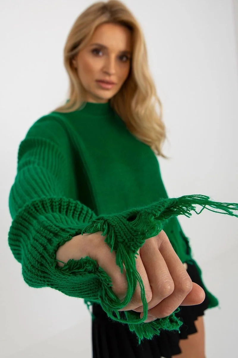 Emerald green chunky knit sweater with frayed sleeves and cuffs.
