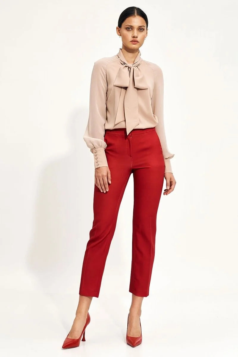 Red straight-leg trousers with a high waist and subtle stitching detail, on a model.