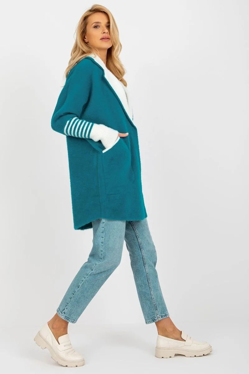 Teal angora blend cardigan with white striped cuffs and cream loafers on model.
