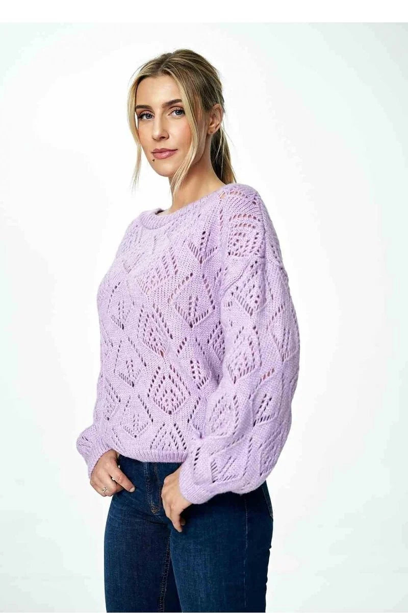 Lavender open-knit sweater with diamond pattern and long sleeves, worn by a model.