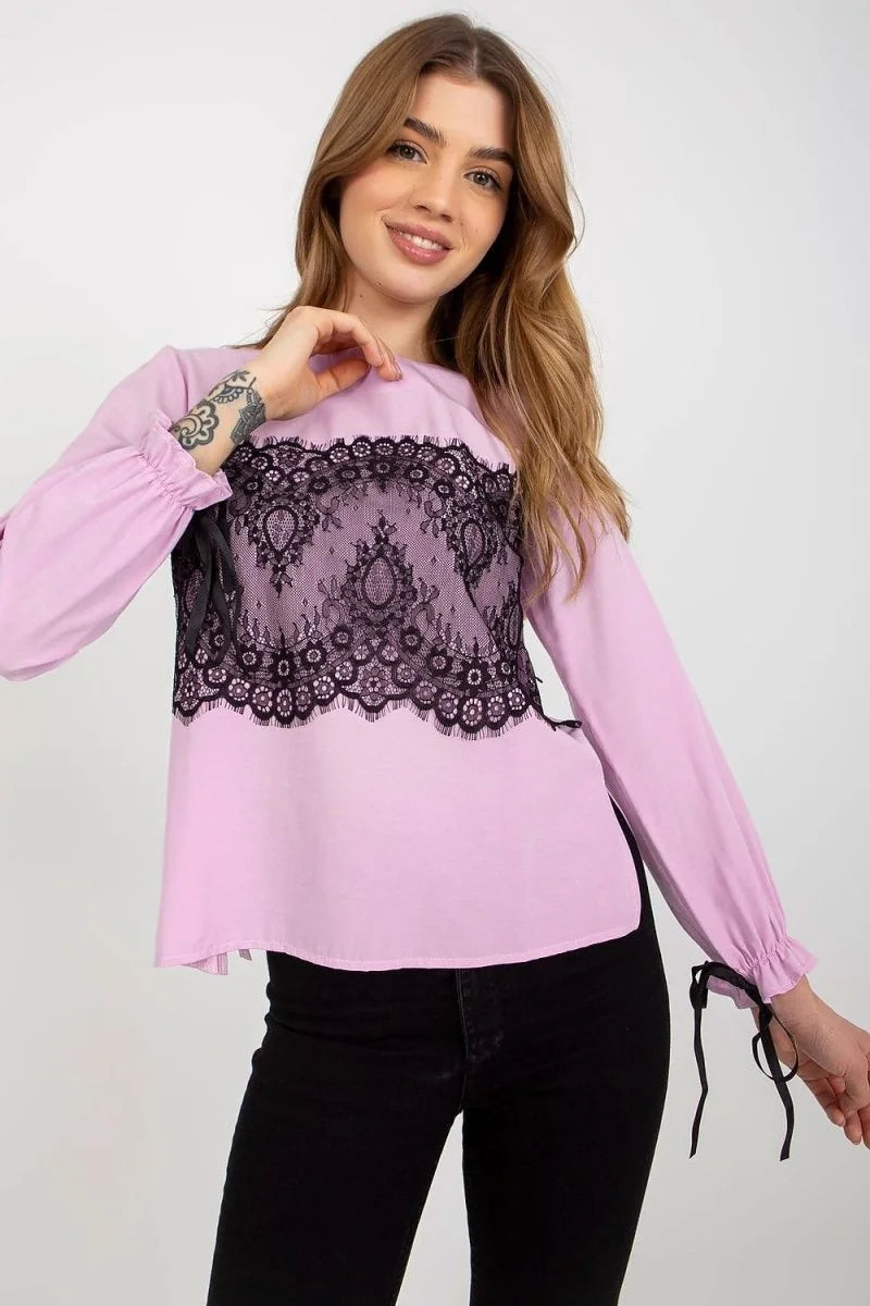 Light pink long-sleeve top with black lace overlay and tie details on sleeves.