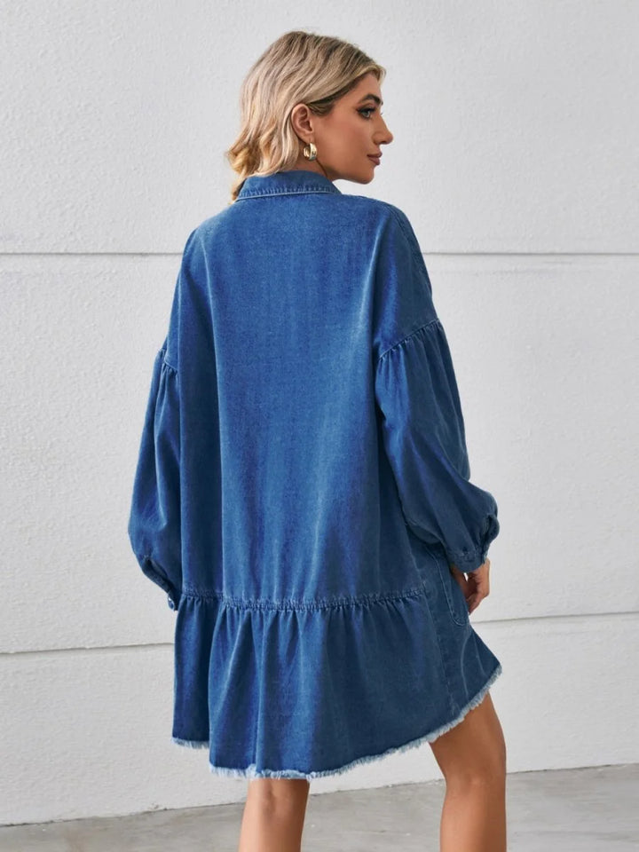 Denim shirt dress with ruffled hem and balloon sleeves, showing back view.
