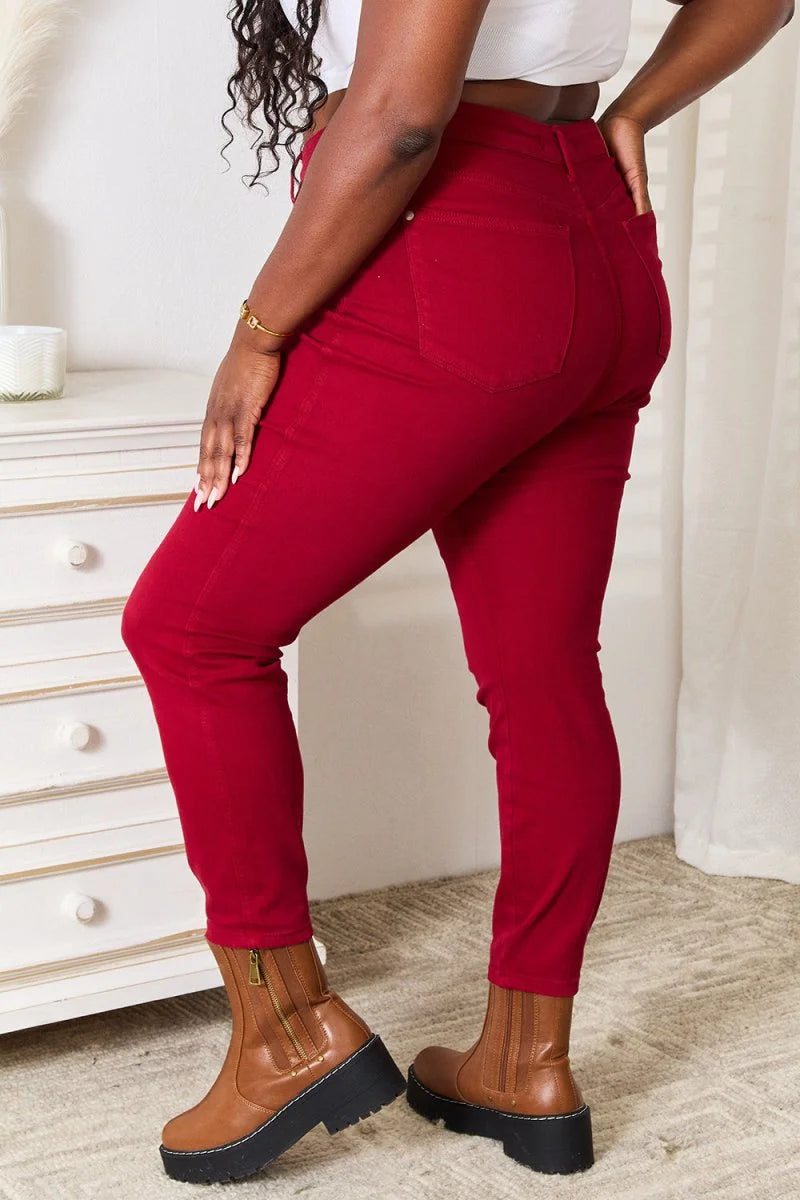 Red skinny jeans with brown platform boots, close-up of legs and boots.