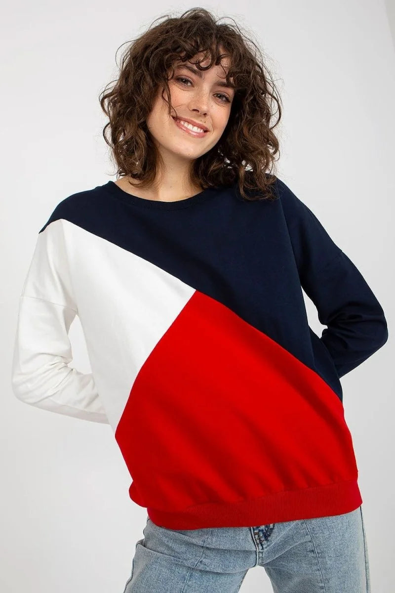 Navy, white, and red colorblock long-sleeve sweatshirt with a crew neck on a model.