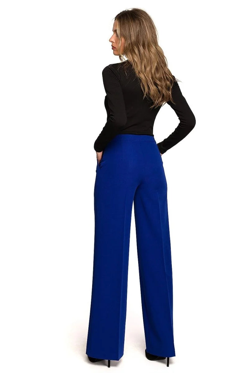 Women's royal blue wide-leg trousers with a smooth texture, shown from the back.