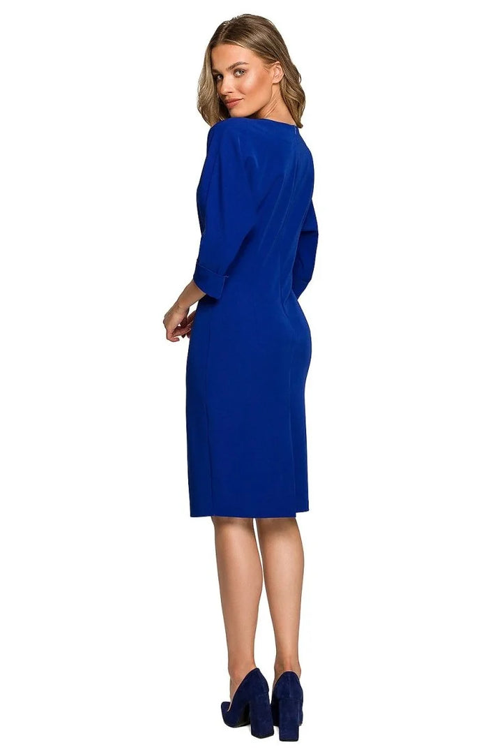 Royal blue dress, three-quarter sleeves, midi length, on model, with matching block heels.