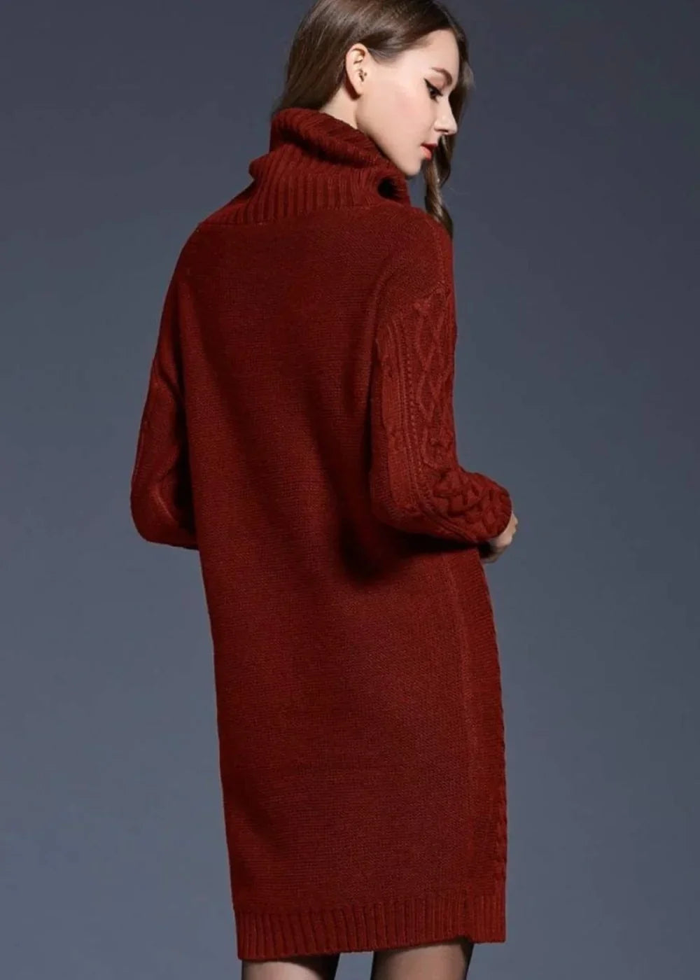 Wine-colored knit sweater dress with turtleneck and cable-knit sleeves on a model.