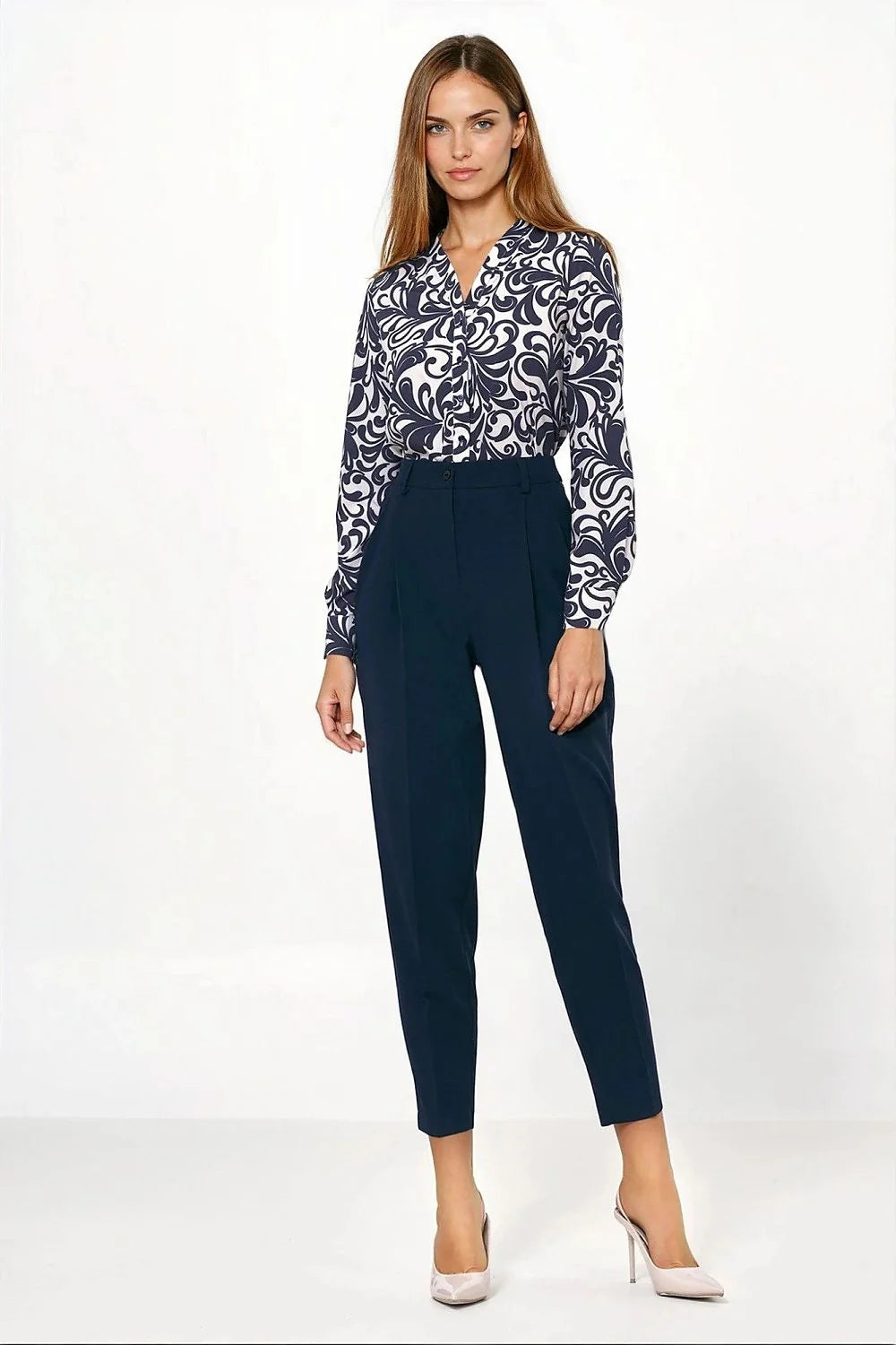 Navy blue trousers with a regular fit and subtle pleating, worn by a model.