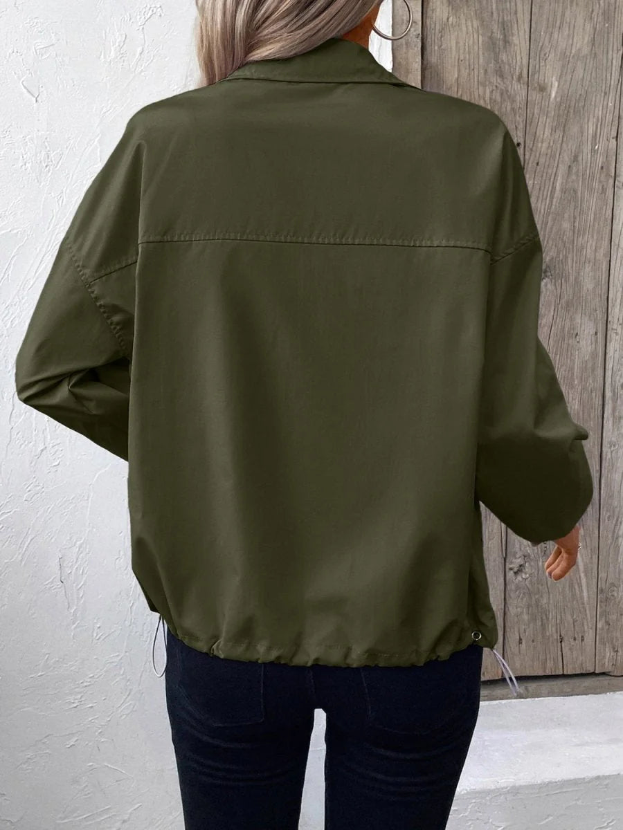 Back view of a green polyester jacket with a drawstring hem.