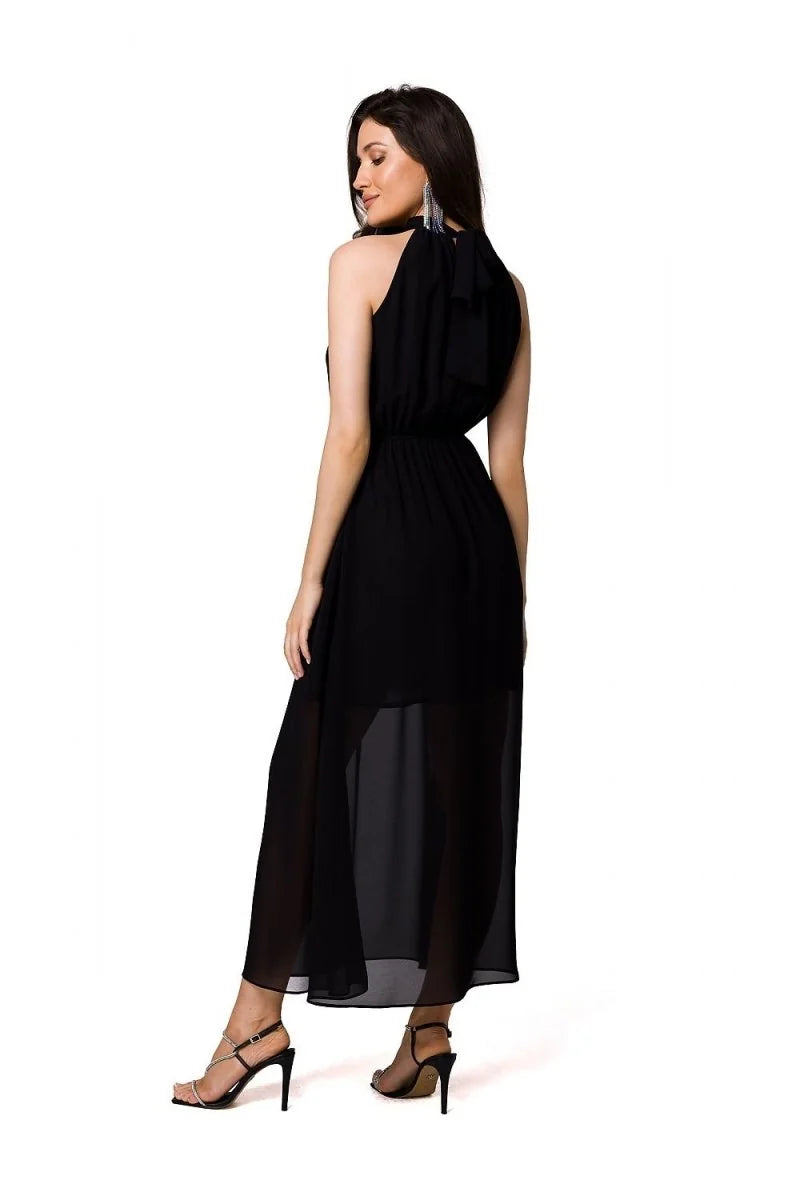 Black high-neck chiffon maxi dress with rhinestone-strap heels, shown from the back.