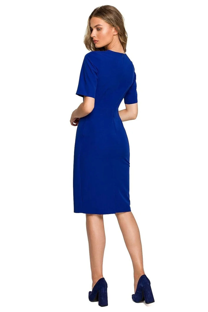Royal blue fitted dress with short sleeves, paired with navy blue block heel pumps.