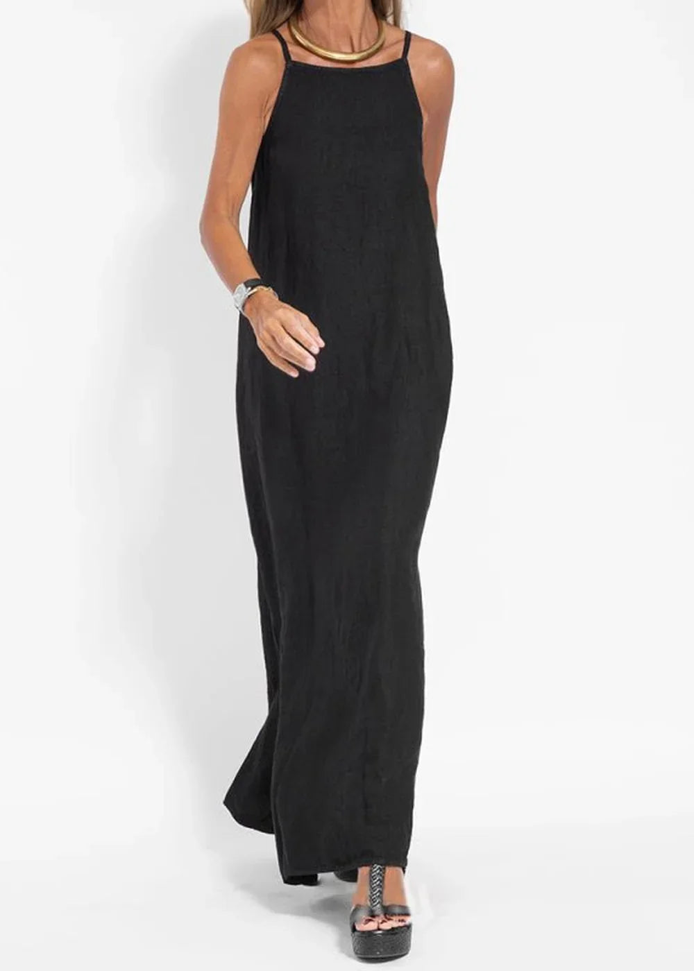 Full-length black linen-blend maxi dress with spaghetti straps and a gold choker on a model.