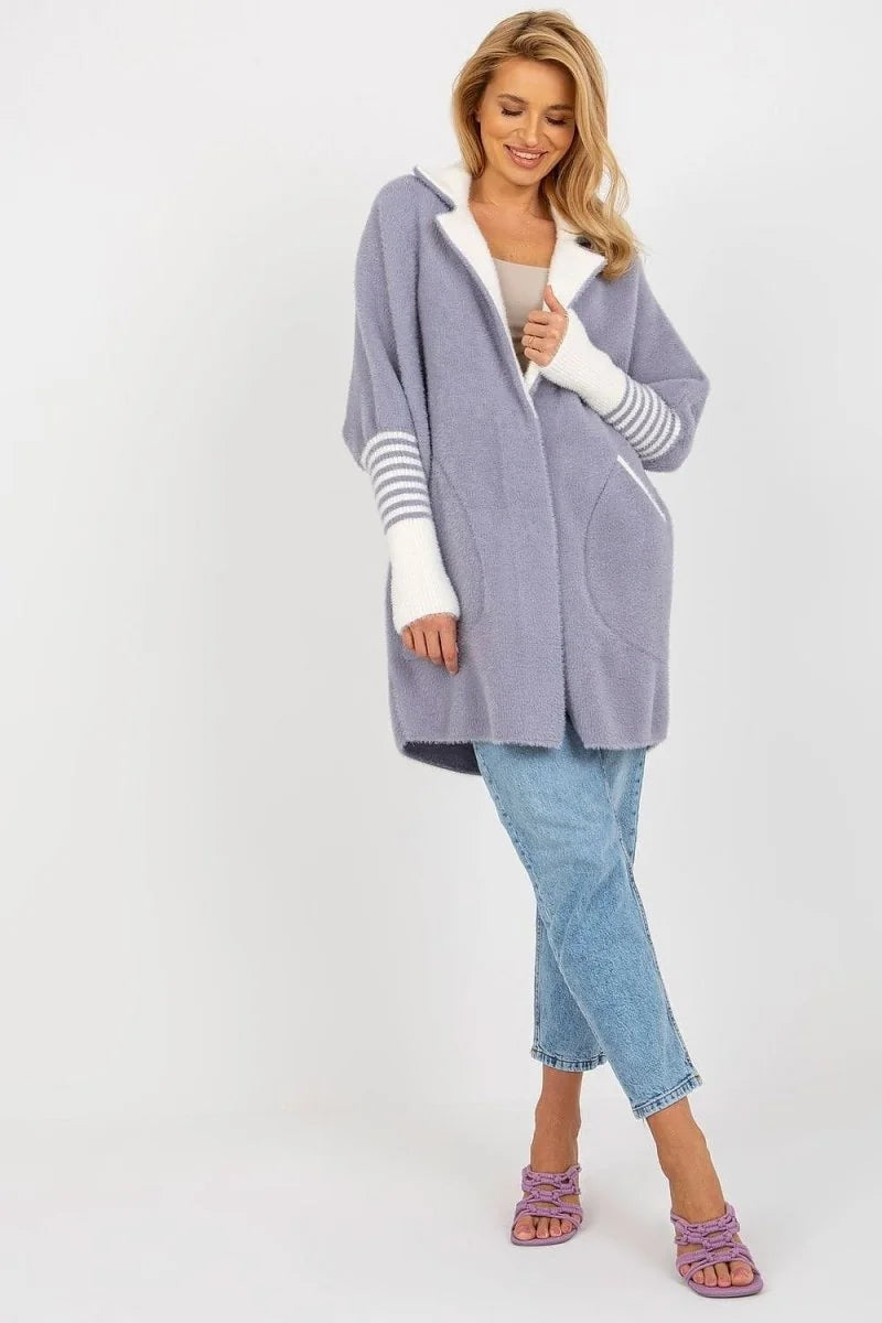 Light purple fuzzy cardigan with white striped sleeves and collar, worn by a model with light blue jeans.