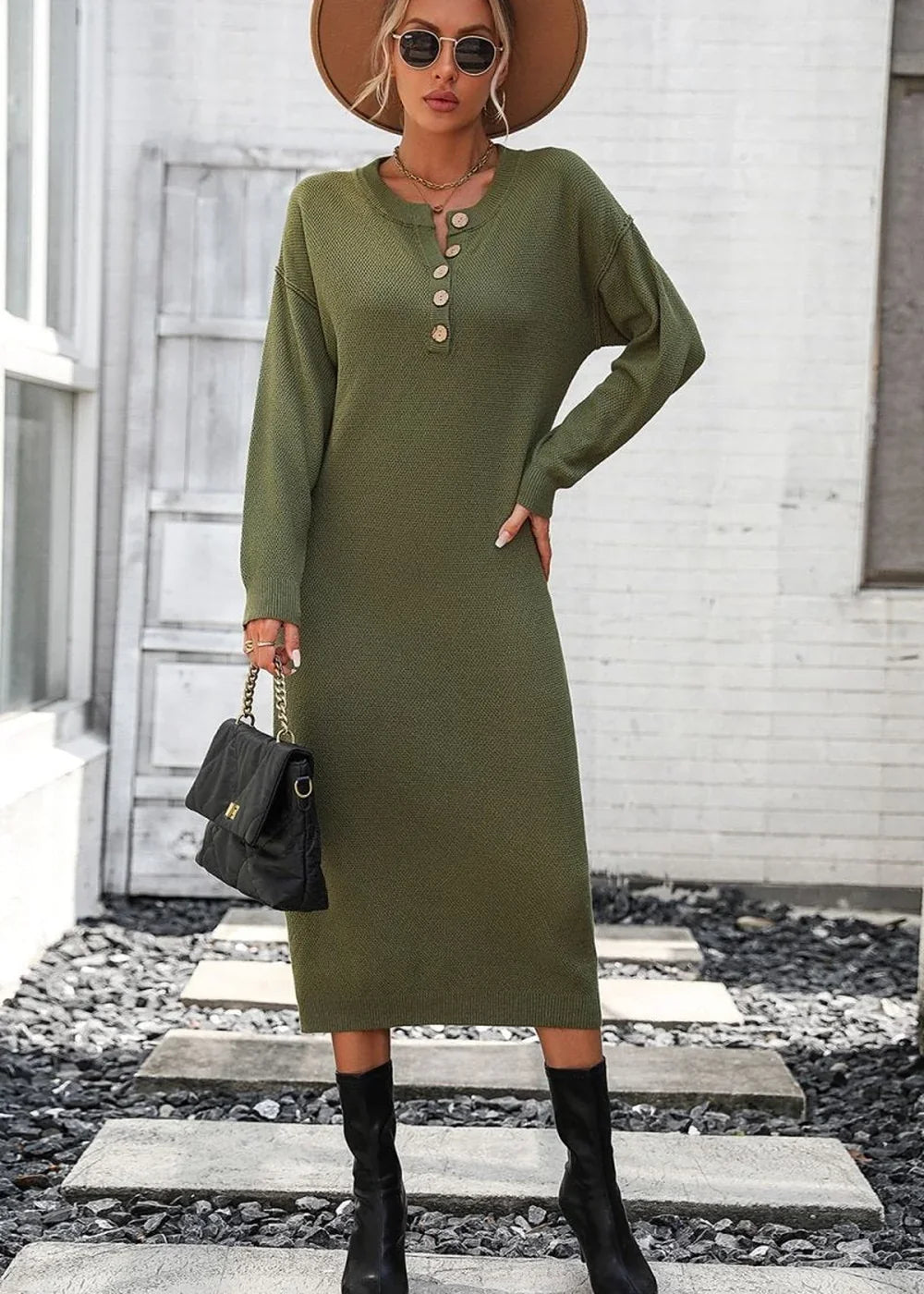 Olive green knit midi sweater dress with button neckline, worn with black boots and handbag.