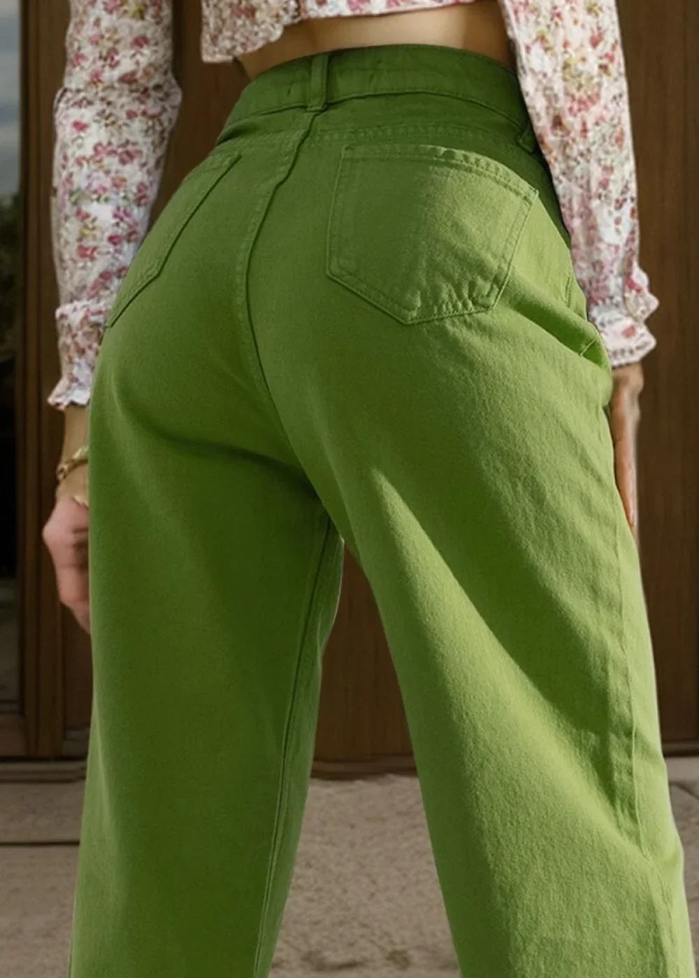 Close-up of bright green cotton blend pants showing texture and pocket details.