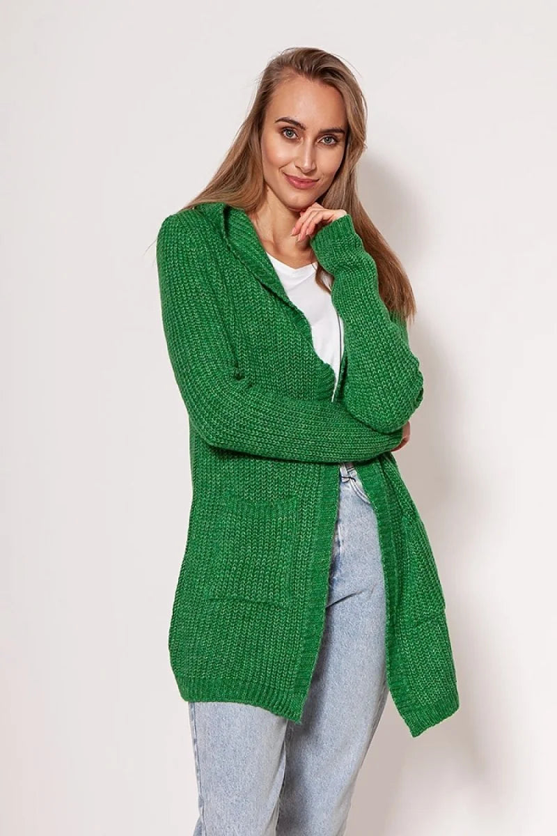 Green hooded knit cardigan with pockets, worn by a model with light blue jeans.
