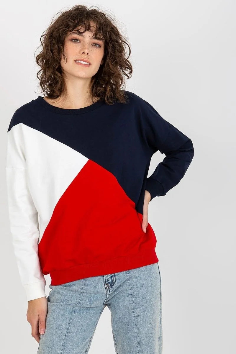 Navy, white, and red colorblock sweatshirt with a round neckline and long sleeves, worn by a model.