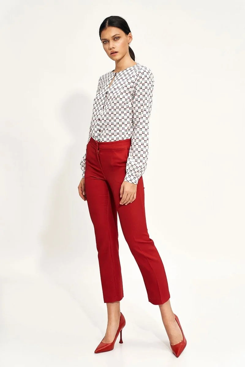 Red high-waisted trousers with a regular fit, shown on a model.