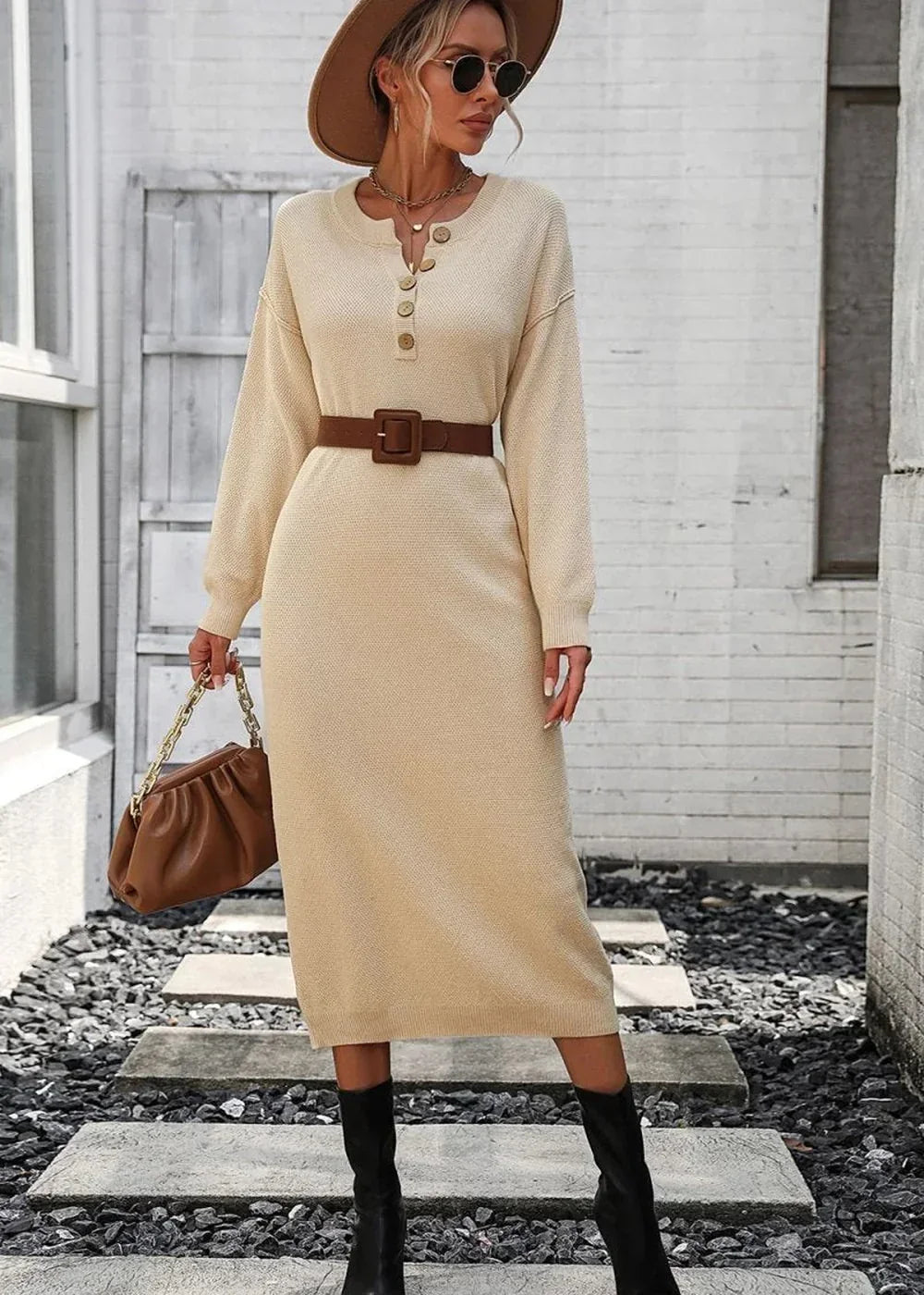 Cream knit midi dress with button neckline, brown belt, and chain bag.