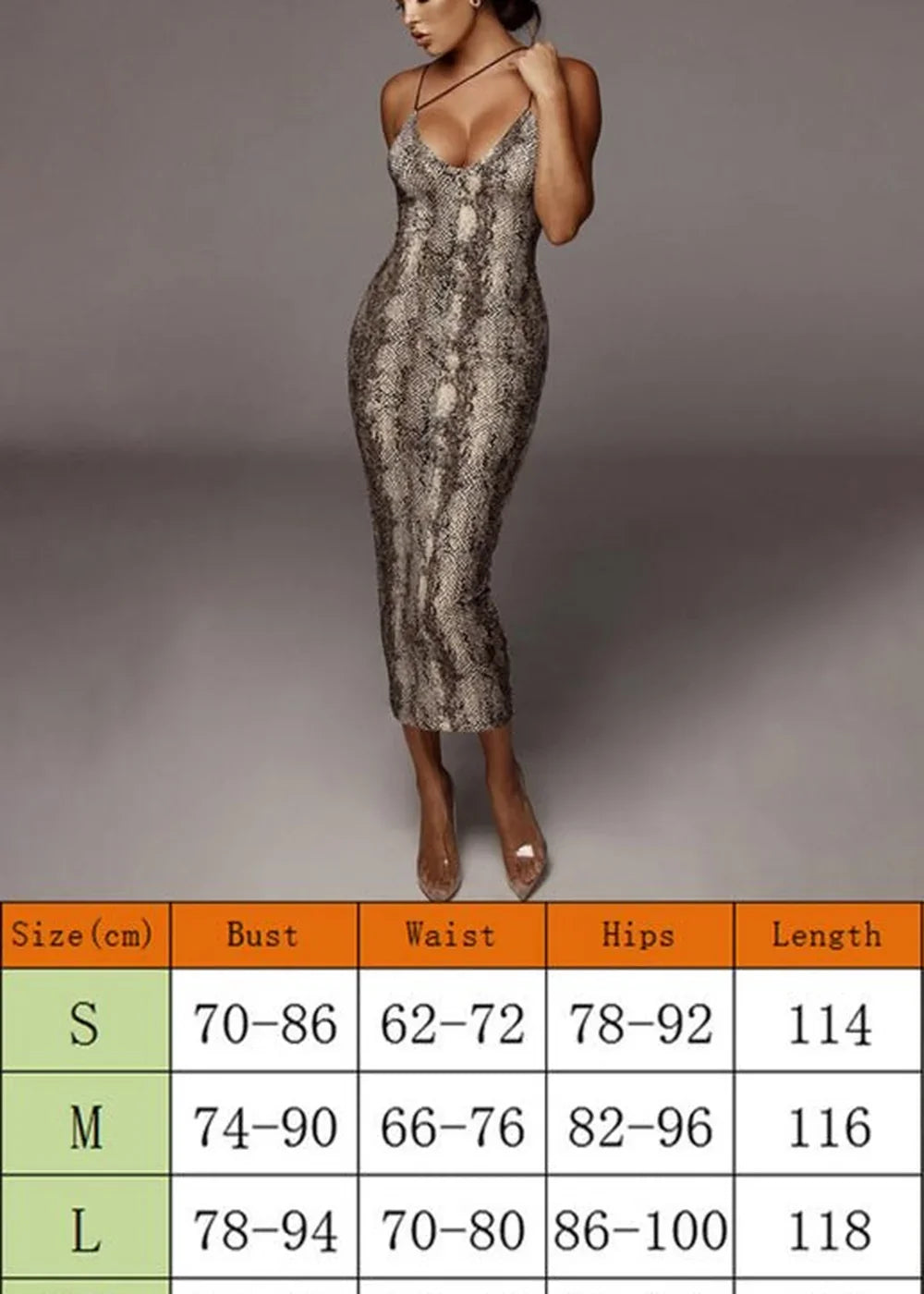 A woman in a form-fitting, knee-length snake print dress with spaghetti straps, paired with clear heels.