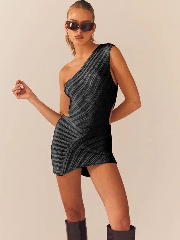 Black one-shoulder mini dress with a textured, ribbed design and cutouts, worn by a model.