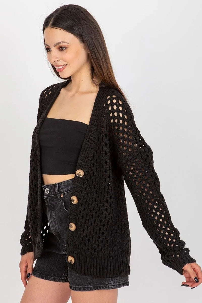 Black crochet knit cardigan with button closure and denim shorts on a model