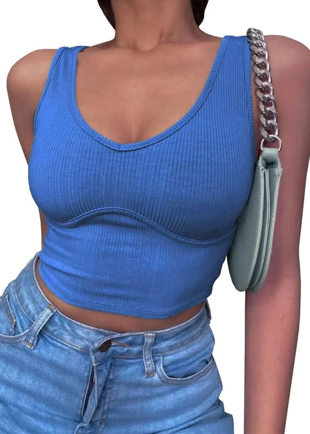 Blue ribbed knit crop top with V-neck and corset-style seams, paired with light wash denim jeans.