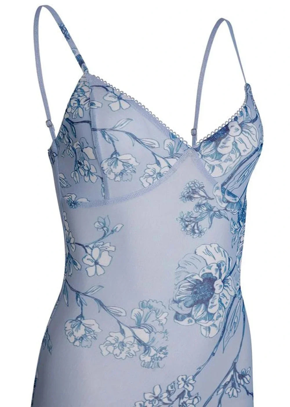Light blue sheer slip dress with a delicate floral print and thin adjustable straps, white background.