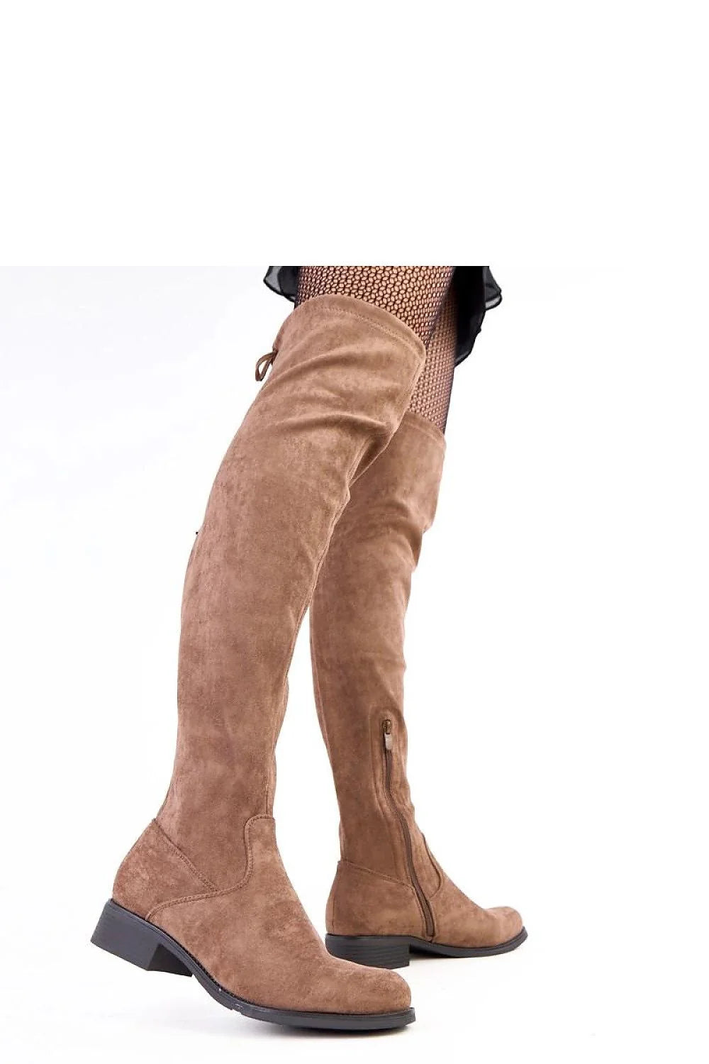 Brown suede over-the-knee boots with a side zipper and tie detail on a model.