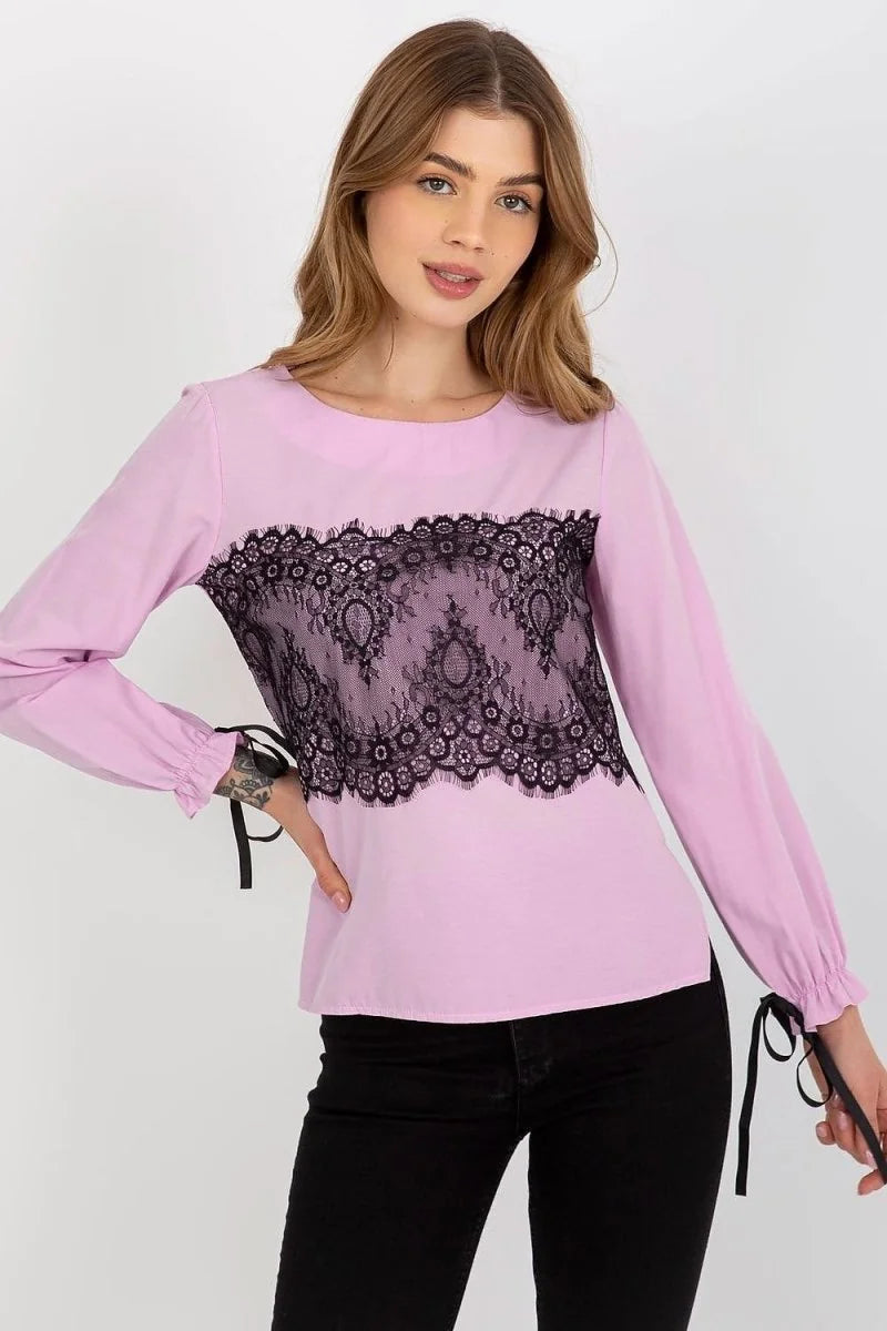 Lilac long-sleeve top with black lace inset and tie details on cuffs, on model.