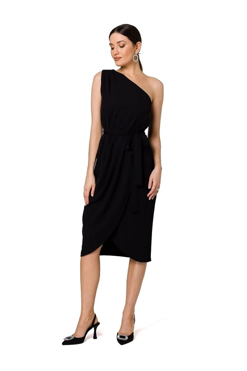 Black one-shoulder cocktail dress with a tie waist and tulip skirt, worn by a model.