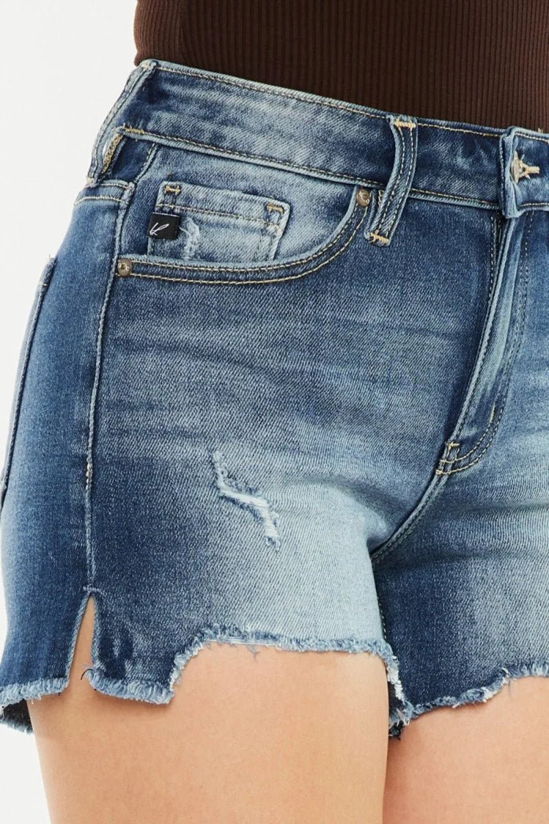 Distressed, light-wash denim shorts with frayed, cut-off hem and side slits.