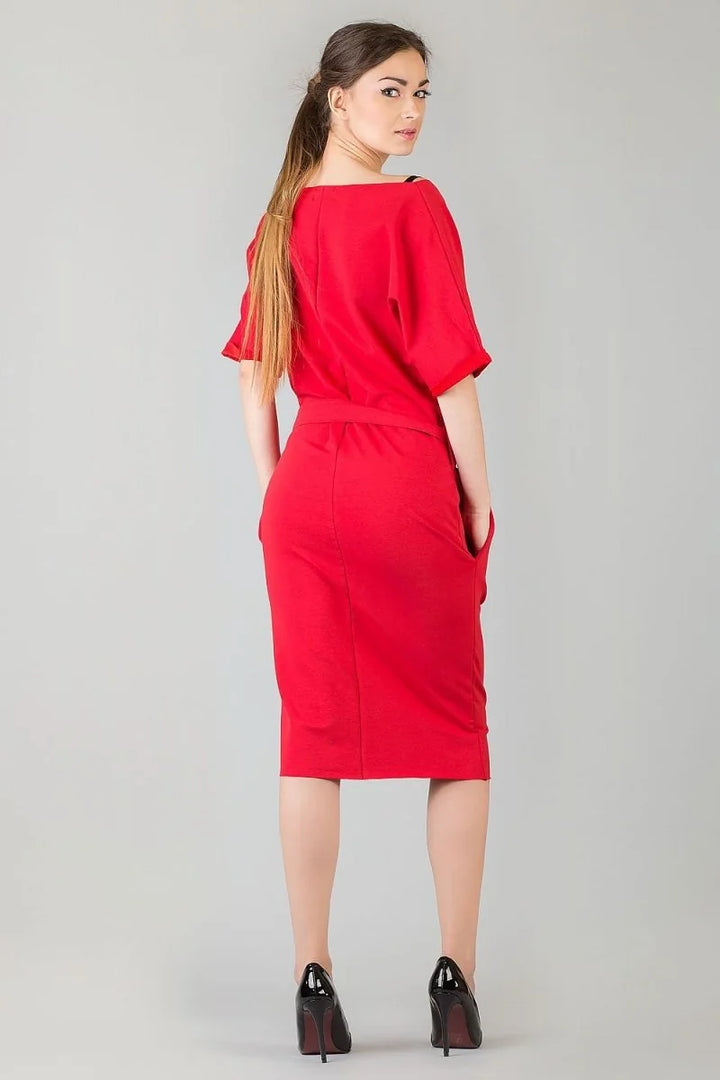 Red relaxed fit cotton blend dress with short sleeves, cinched waist, and pockets, worn with black heels.