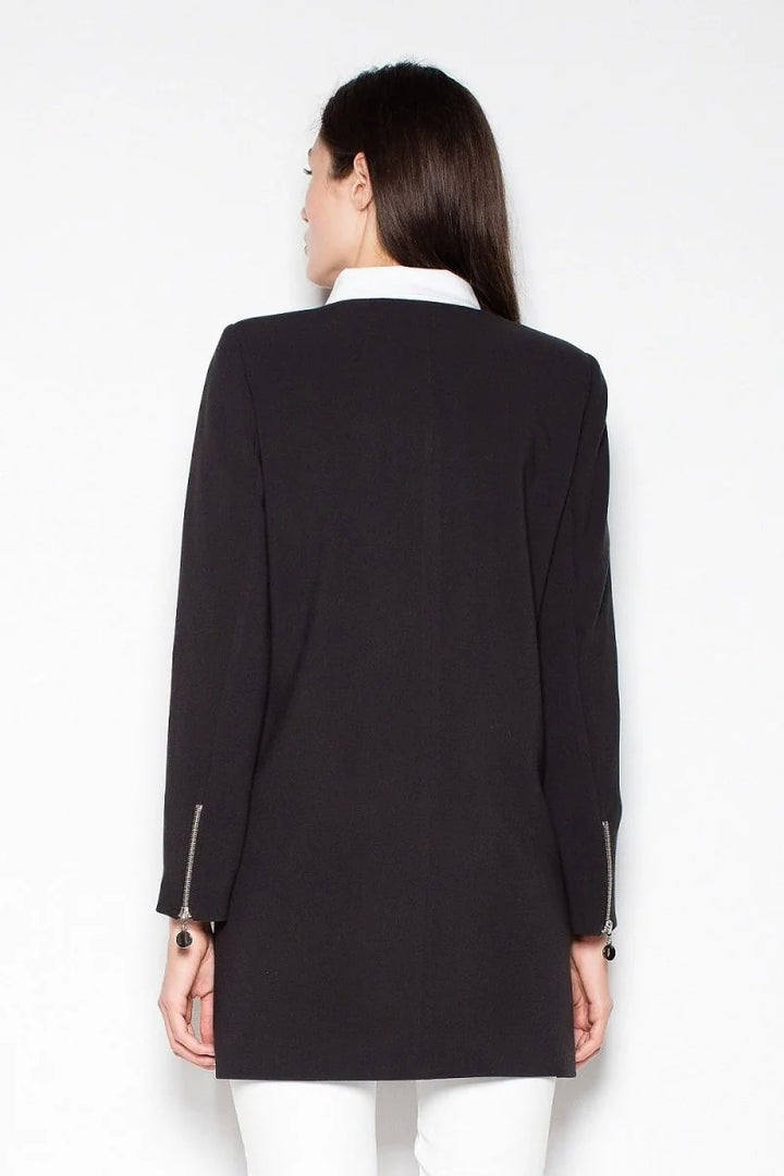 Black blazer with silver zipper detail and round charm on cuffs, showing back view.