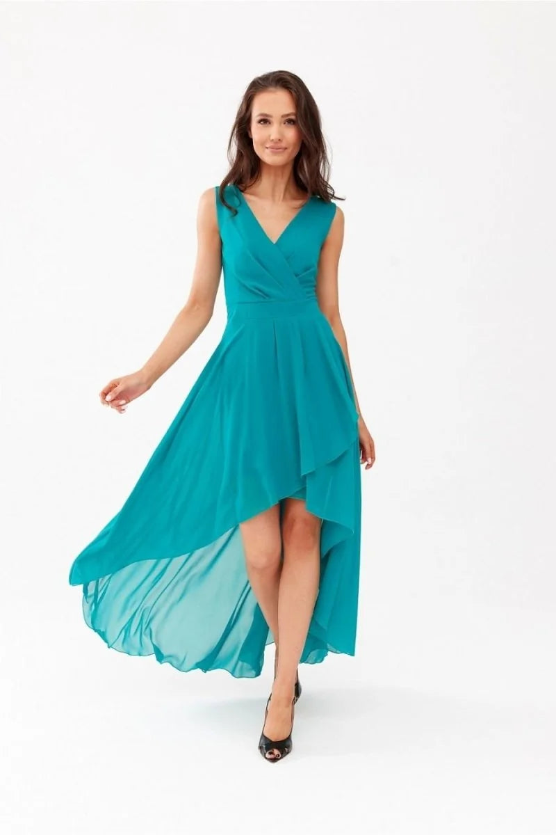 Teal asymmetrical high-low dress with a V-neck and flowing chiffon fabric, shown on a model.
