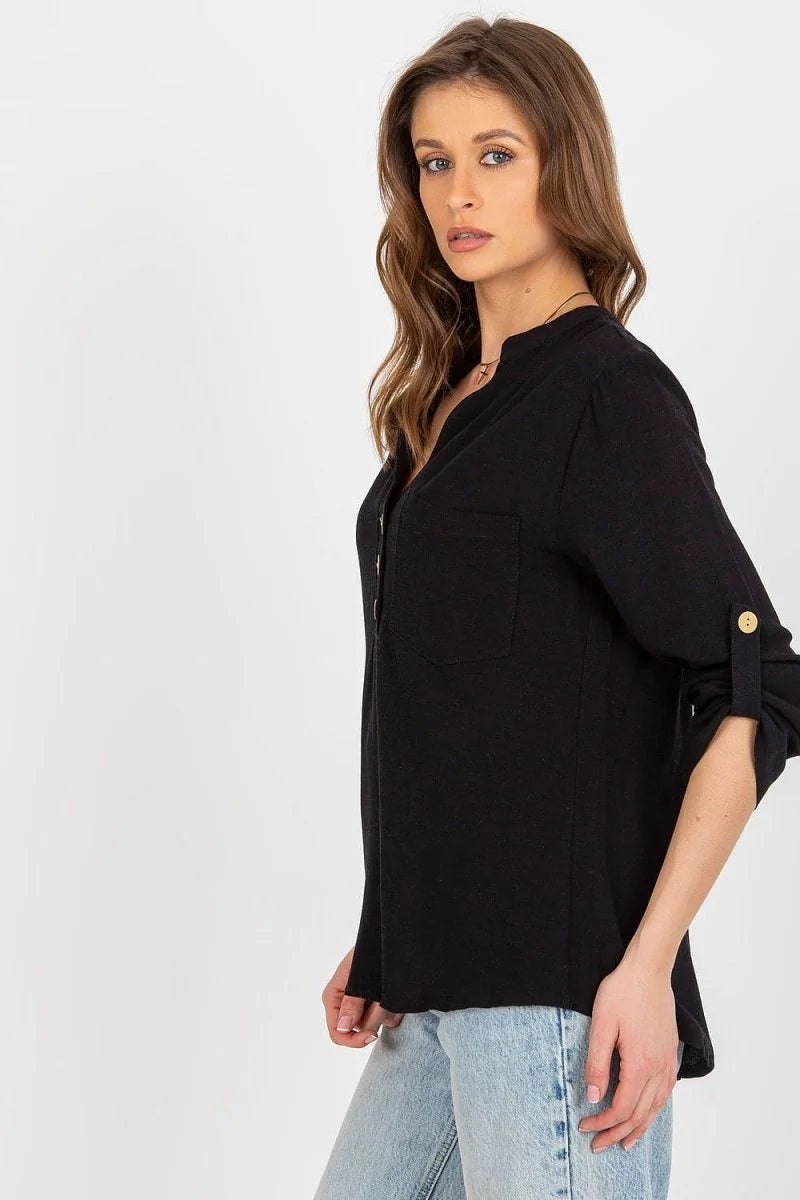 Black linen-blend shirt with roll-tab sleeves and a chest pocket on a woman.