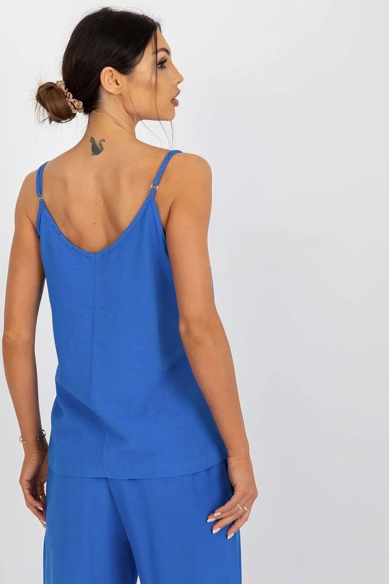 Model from back in a loose-fitting, royal blue V-neck camisole and matching wide-leg pants.