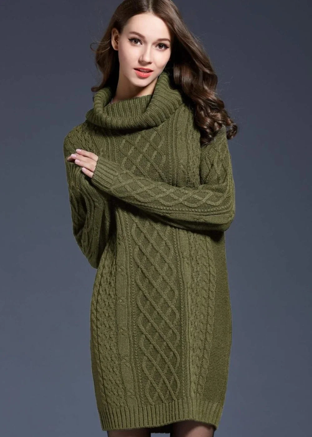 Green cable knit turtleneck sweater dress with long sleeves on a model.